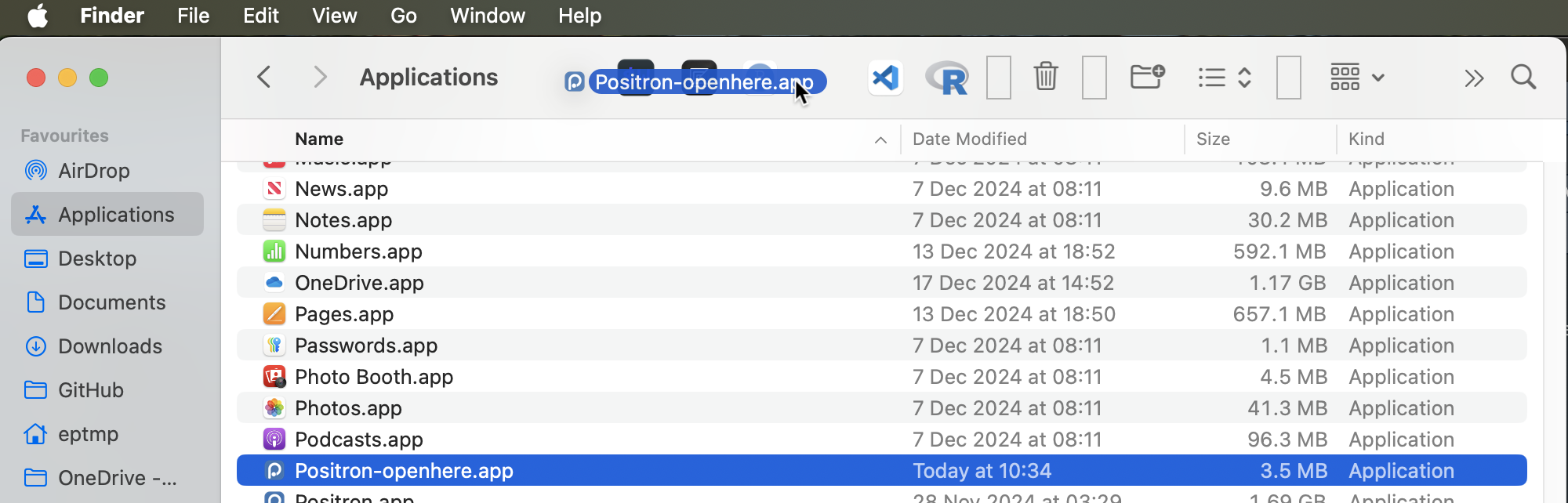 Screenshot of moving our Positron-openhere app onto the Finder toolbar.